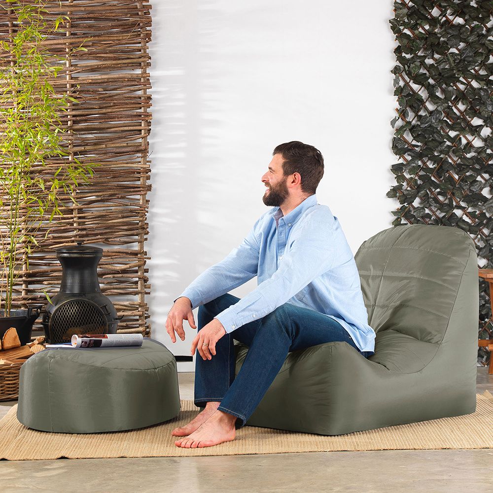 Veeva® Vista Indoor Outdoor Footstool olive with male model