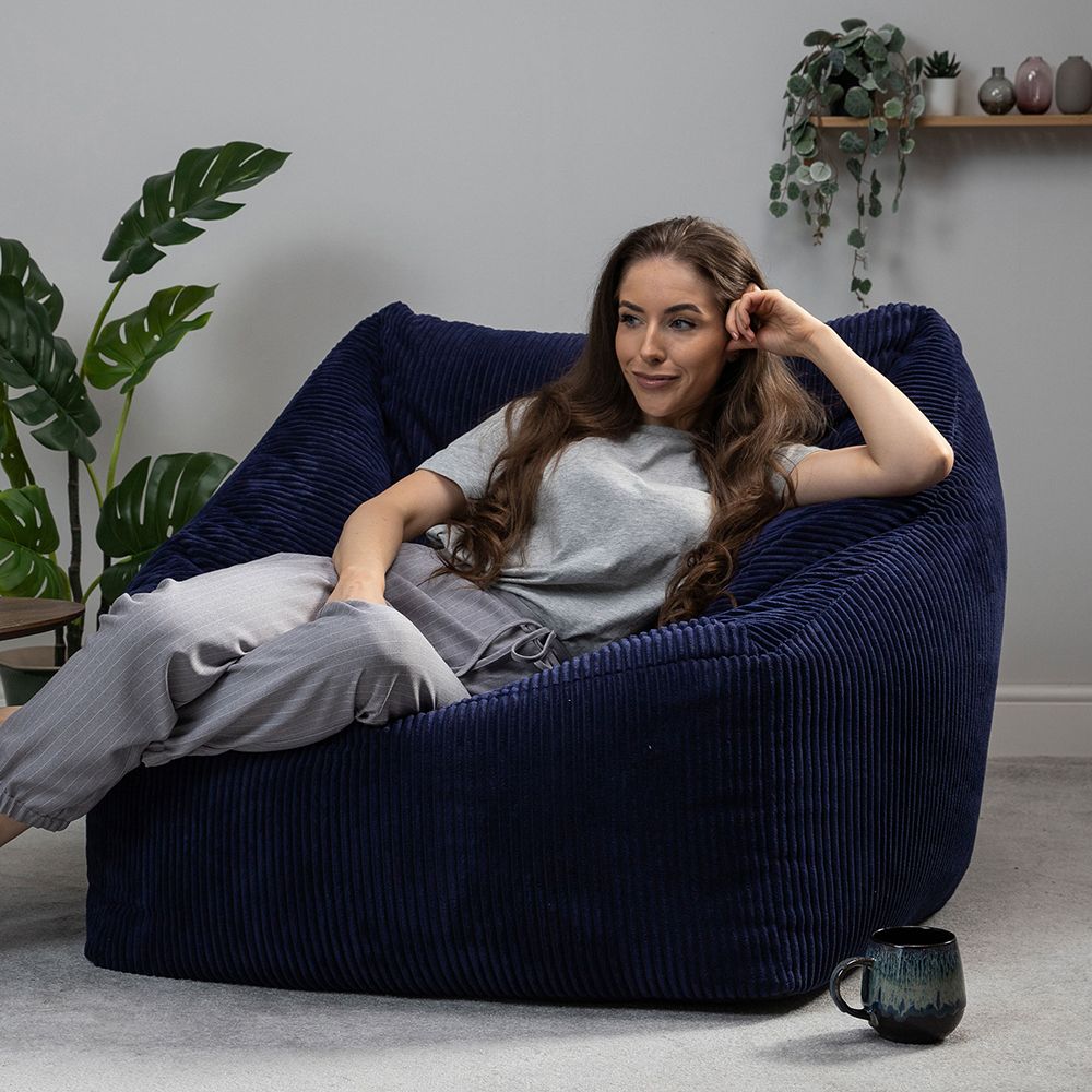 icon® Morgan Cord Armchair Bean Bag in navy with model