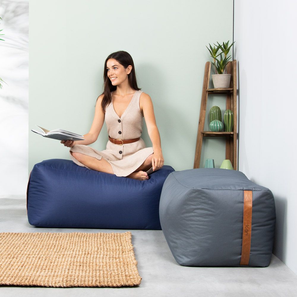 Lady sitting on Navy Bean Bag Bench with handle in living room
