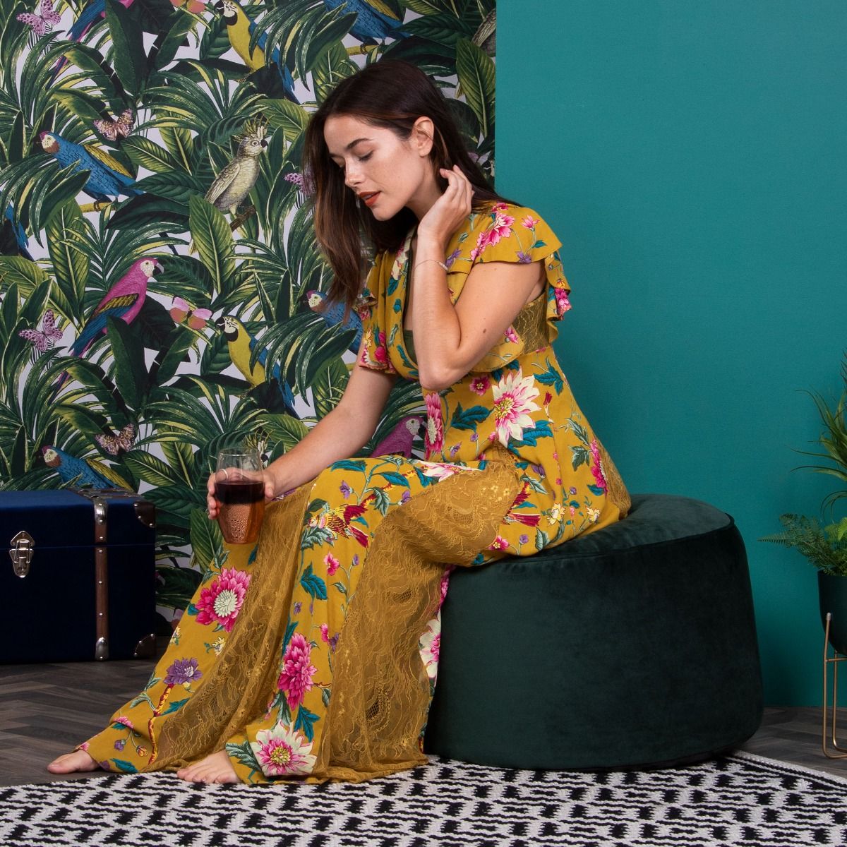 Lady sitting on green velvet 