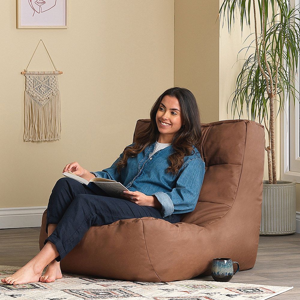 icon® Lorenzo Faux Leather Lounger Bean Bag in brown with model